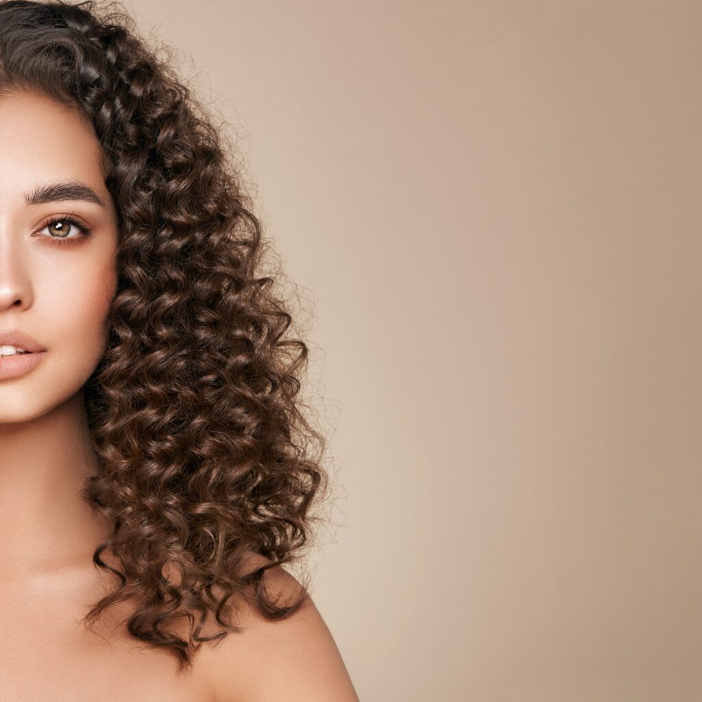 Beautiful smiling woman with afro curls