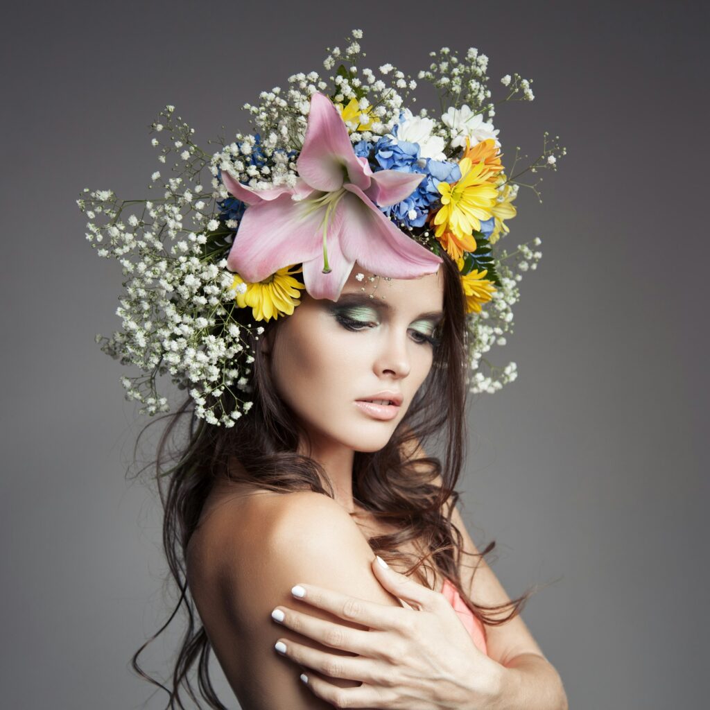 Beautiful Woman With Flower Wreath On Her Head.